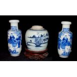 A PAIR OF ANTIQUE CHINESE BLUE AND WHITE PORCELAIN VASES Hand painted with Elders in a floral