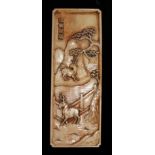 A KANGXI RECTANGULAR IVORY PANEL The tall plaque carved with deer in a landscape below a pine