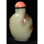 AN 18TH CENTURY FINE CELADON JADE SNUFF BOTTLE The rounded body well carved with lion handles to