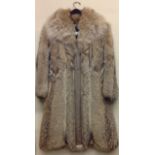 AMORESS, STOCKHOLM, A VINTAGE SWEDISH WOLF FUR AND TAUPE LEATHER LONG COAT With side pockets,