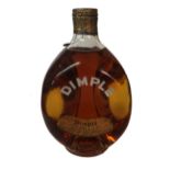 A VINTAGE BOTTLE OF JOHN HAIGS DIMPLES WHISKEY The sealed cap with John Haig monogram to top. (h