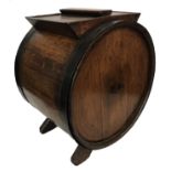 A 19TH CENTURY OAK BARRELL With iron straps and lift off lid.