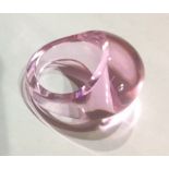 LALIQUE, A VINTAGE CABOCHON CUT PINK CRYSTAL RING Bearing maker's mark to shank and held in a red