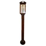 AN EARLY 20TH CENTURY MAHOGANY CASED STICK BAROMETER Having a broken pediment and acorn finial