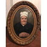 A PAIR OF VICTORIAN OVAL OIL ON CANVAS Portraits of an elderly lady wearing a chef's hat and a