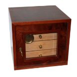 A 20TH CENTURY BURR WALNUT HUMIDOR CUBE CABINET With a glazed door opening to reveal four