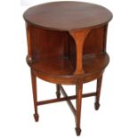 AN ART NOVEAU PERIOD AND DESIGN MAHOGANY AND MARQUETRY INLAID REVOLVING BOOK TABLE With circular