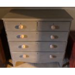 A VICTORIAN PAINTED CHEST OF DRAWERS Having two short over three long drawers over a shaped