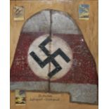 A GERMAN FRAMED TAIL SECTION OF CANVAS Bearing swastika from a German glider, in script below '