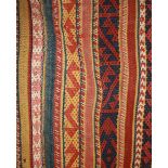 AN ANTIQUE WOOLLEN KILIM WALL HANGING Hand who pen with bands of colour.