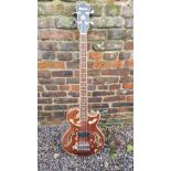 IBANEZ, A SEMI ACOUSTIC BASS GUITAR The body with naturalistic finish, f-hole cut outs and a