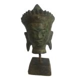 AN ANTIQUE BRONZE HEAD OF A BUDDHA On stand. (12cm)