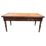 A 19TH FRENCH FRUITWOOD FARMHOUSE TABLE With two draw leaves and two drawers, raised on turned legs.