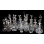 A QUANTITY OF TWENTY-FIVE EDWARDIAN AND LATER GLASS DECANTERS To include a matched set of three,