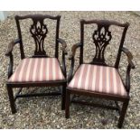 A PAIR OF 18TH CENTURY DESIGN MAHOGANY OPEN ARMCHAIRS Having pierced vase splatbacks and upholstered