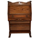 AN EARLY 20TH CENTURY ARTS & CRAFTS OAK BUREAU Narrow proportions with a fall front and single