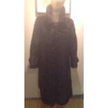 M. FLETCHER, SOUTHPORT, A VINTAGE DARK BROWN MINK FUR COAT With a neat collar, clip fastening and