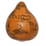 A VINTAGE ORIENTAL DRIED SCRIMSHAW GOURD/NUT Pear form with an engraved decoration of exotic
