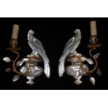 A PAIR OF GILT METAL AND GLASS WALL LIGHTS MODELLED AS PARROTS