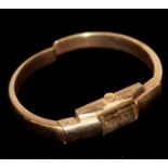 A 9CT GOLD MID CENTURY LADIES' BANGLE WRISTWATCH The rectangular dial marked 'Majex'. (approx 5cm)