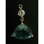 A LARGE BLUE STONE AND DIAMOND PENDANT.