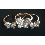 A SET OF THREE GRADUATED 18CT GOLD AND DIAMOND BUTTERFLY RINGS ENCRUSTED WITH DIAMONDS.