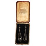 A PAIR OF EDWARDIAN YELLOW GOLD AND DIAMOND EARRINGS Set with two pear cut diamonds held in a