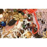 A COLLECTION OF VINTAGE COSTUME JEWELLERY Including a coral necklace, an agate and white metal