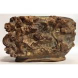 A 17TH/18TH CENTURY CHINESE SOAPSTONE BRUSH POT Finely carved with a mythical scene of stylized