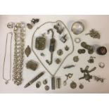 A SELECTION OF SILVER AND WHITE METAL ITEMS To include two 20th Century silver ingot pendants, a