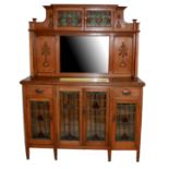 A 19TH CENTURY OAK AND STAINED GLASS ARTS AND CRAFTS MIRROR BACK SIDEBOARD Two small glazed