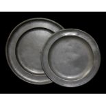 TWO PAIRS OF ANTIQUE CIRCULAR PEWTER PLATES Bearing touch marks to rear 'London', together with a