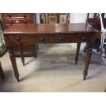 A VICTORIAN MAHOGANY SIDE TABLE With two drawers, raised on turned legs, along with an Edwardian