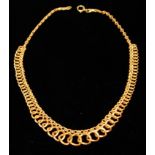 A VINTAGE 18CT GOLD NECKLACE Having tapering intertwined links leading to a box link clasp. (