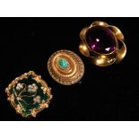 A COLLECTION OF THREE VICTORIAN BROOCHES Comprising a yellow metal mourning brooch set with seed