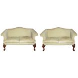 A PAIR OF EARLY GEORGIAN DESIGN TWO SEAT SETTEES With humpbacks and scroll arms, raised on four