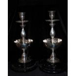 AN UNUSUAL PAIR OF 20TH CENTURY SILVER PLATED BALUSTER CANDLESTICKS WITH CIGAR HOLDER SECTIONS