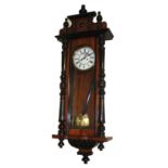 A 19TH CENTURY VIENNA MAHOGANY WALL CLOCK Architectural style case with turned column supports,