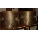 A LARGE PAIR OF 20TH CENTURY BRASS CYLINDRICAL LOG BINS Each with beaten finish and four ring