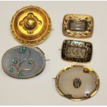 A COLLECTION OF THREE YELLOW METAL MOURNING BROOCHES To include a circular Etruscan style with