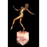 AN EARLY 20TH CENTURY BRONZE AND MARBLE ART DECO FIGURE OF A FEMALE DANCER Wearing a stylized