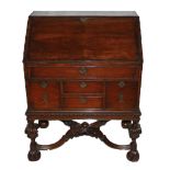 A QUEEN ANNE REVIVAL MAHOGANY BUREAU The fall front fitted with a chinoiserie decorated interior,