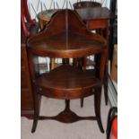 A GEORGIAN MAHOGANY CORNER WASHSTAND Along with three plant stands.