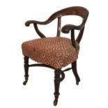 AN EARLY 19TH CENTURY MAHOGANY CAPTAIN'S CHAIR Upholstered seat raised on turned legs, joined by