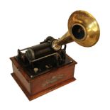 AN EARLY 20TH CENTURY BRASS HORN PHONOGRAPH Having a ebonized mechanism and brass trumpet marked '