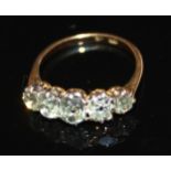 A VINTAGE 18CT GOLD AND DIAMOND FIVE STONE RING Set with five graduating oval cut stones held in a