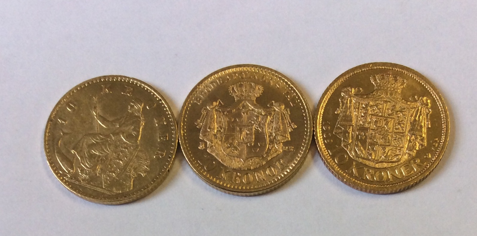 A COLLECTION OF THREE DANISH 22CT GOLD TEN KRONER COINS, DATED 1909, 1901 and 1874 Bearing the Royal