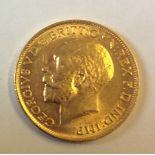 AN EARLY 20TH CENTURY 22CT GOLD SOVEREIGN COIN, DATED 1913 Bearing a portrait of King George V and