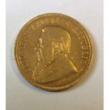 A 22CT GOLD SOUTH AFRICA ONE POUND COIN, DATED 1895 Bearing a portrait of President Kruger and the