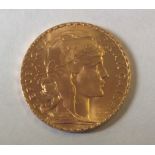 A FRENCH 22CT GOLD TWENTY FRANC COIN, DATED 1911 Bearing a cockerel to reverse and marked 'Liberte